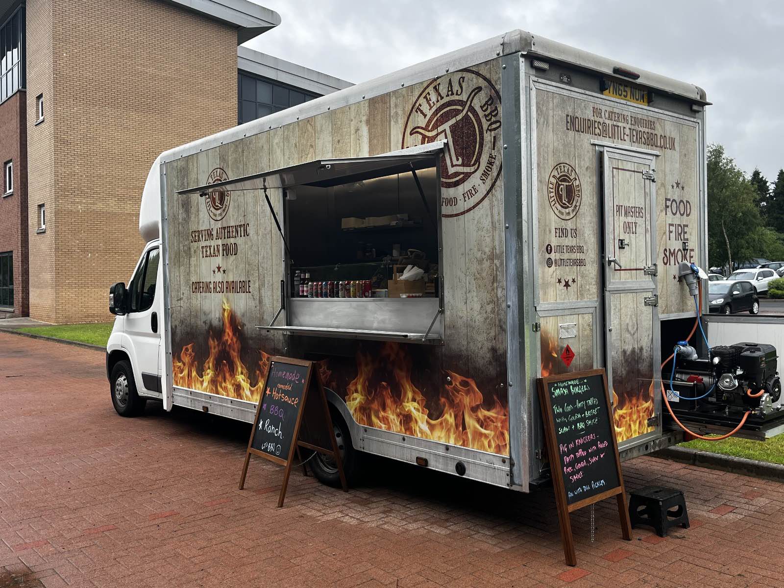 a BBQ food truck with flame decals.